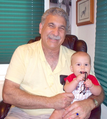 Dr Grossman hold Smitty at 6 months old roanoke island animal clinic